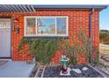 Brick facade with ivy and a bird bath at 3324 N Glencoe St, Denver, CO 80207