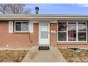 Front entrance with white door and welcome mat at 1441 E 84Th Pl, Denver, CO 80229