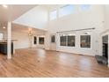 Bright living room with wood floors, fireplace, and large windows offering plenty of natural light at 5294 S Espana St, Centennial, CO 80015