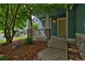 Inviting covered porch with stone accents and wood railings offering curb appeal at 2500 Lexington St, Lafayette, CO 80026