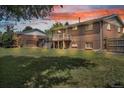 Expansive backyard featuring a spacious lawn and exterior views of the deck, stairs, and fencing at 8759 Seton St, Westminster, CO 80031