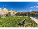 Well-maintained apartment complex with green space, benches, and street parking for convenience and relaxation at 9019 E Panorama Cir # D218, Englewood, CO 80112