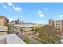 Expansive city view from a high vantage point on a clear, sunny day with blue skies and some clouds at 1780 N Washington St # 405, Denver, CO 80203