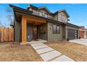 Inviting front porch featuring a cozy seating area, tongue and groove ceiling, and a stylish front door at 501 Lois Dr, Louisville, CO 80027