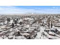 An aerial view of a neighborhood with a cityscape in the background at 4518 Vallejo St, Denver, CO 80211