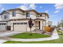 Charming two-story home with a large driveway and newly landscaped yard at 9297 Truckee Ct, Commerce City, CO 80022