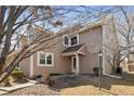 Charming home exterior featuring neutral siding, well-kept landscaping and a covered entryway at 1929 S Xanadu Way, Aurora, CO 80014