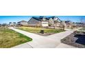 Scenic street view featuring lush green lawns, mature trees, and charming homes on a sunny day at 469 S Olathe St, Aurora, CO 80017