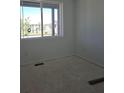 A bright bedroom featuring a large window that provides lots of natural light at 418 Grey Rock St, Brighton, CO 80601
