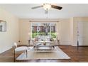 Cozy living room with large picture window that lets in lots of natural light at 12708 W Virginia Ave, Lakewood, CO 80228