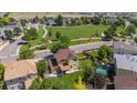 Aerial shot showcasing a well-maintained backyard, neighboring homes, and community green space, ideal for families at 6260 E 114Th Ave, Thornton, CO 80233