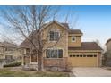 Inviting two-story home with a combination of stone and siding, providing a cozy and stylish curb appeal at 6260 E 114Th Ave, Thornton, CO 80233