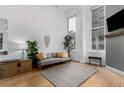 Bright and airy living room with a comfortable couch, large windows, and a neutral color palette at 720 16Th St # 311, Denver, CO 80202