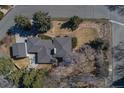 An aerial view showcases the home's roof, large yard, mature trees, landscaping, and neighborhood at 2605 Crabapple Ct, Golden, CO 80401