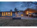Spacious backyard patio with an outdoor kitchen and dining area perfect for entertaining guests and relaxation at 2605 Crabapple Ct, Golden, CO 80401