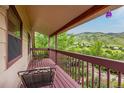 Enjoy mountain views from the private covered balcony with seating area at 473 Somerset Dr, Golden, CO 80401