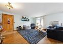 Cozy living room featuring hardwood floors and lots of natural light at 6314 W 92Nd Pl, Westminster, CO 80031
