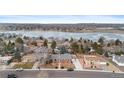 Captivating aerial view of a lakeside neighborhood offering serene surroundings and stunning scenery at 4731 W 66Th Ave, Arvada, CO 80003