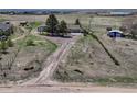 Expansive property featuring a home, garage, and additional buildings on a large lot at 7605 Shenandoah Dr, Elizabeth, CO 80107