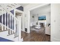 Beautifully appointed living room showing the hardwood floors and updated fireplace at 142 N Logan St, Denver, CO 80203