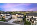 Beautiful two-story home featuring manicured landscaping, a spacious driveway, and an attached two-car garage at 455 Rogers Way, Castle Rock, CO 80104