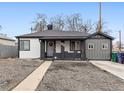 Charming single-story home with a covered front porch and fresh landscaping in a quiet neighborhood at 4463 Steele St, Denver, CO 80216