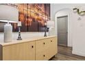 Inviting hallway with modern decor, a stylish console table, and a view of an arched doorway at 4463 Steele St, Denver, CO 80216