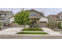 Attractive home with a two-car garage and well-manicured lawn, in a desirable neighborhood at 1063 Sandstone Cir, Erie, CO 80516