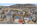 Aerial view of the house showcasing its location within a neighborhood with parks and mountain views at 1304 5Th St, Golden, CO 80403