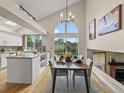 Bright dining area featuring an open layout with high ceilings and windows with lots of natural light at 9016 W Alabama Pl, Lakewood, CO 80232