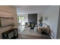 Cozy living room with modern fireplace, stylish furniture, and ample natural light at 12506 E Cornell Ave # 201, Aurora, CO 80014