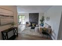 Open living room with fireplace, neutral furniture, and a sliding glass door to let in lots of light at 12506 E Cornell Ave # 201, Aurora, CO 80014