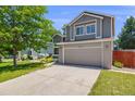 Well maintained two-story home featuring a spacious driveway and an attached two-car garage at 4422 E Andover Ave, Castle Rock, CO 80104
