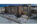 Luxury townhomes in a snow covered community at 2584 Meadows Blvd # E, Castle Rock, CO 80109