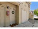 Front door with welcome mat, wreath, and an adjacent storage door to the right at 837 E 98Th Ave # 405, Thornton, CO 80229