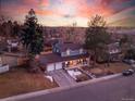 Aerial view of a charming home with well-maintained landscaping and a two-car garage at 6721 S Clayton Way, Centennial, CO 80122