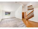 Living room with vaulted ceilings and hardwood floors at 3912 S Atchison Way # E, Aurora, CO 80014