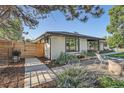 Well-maintained side yard with tasteful landscaping, modern walkway, and a privacy fence at 3695 E Dartmouth Ave, Denver, CO 80210