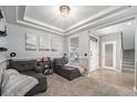 Inviting living room with comfortable seating, coffered ceilings, and stylish entryway view at 4073 S Liverpool St, Aurora, CO 80013