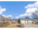 Charming home with a spacious driveway and manicured front lawn at 3700 Miller St, Wheat Ridge, CO 80033