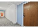 Apartment building hallway with a door to unit 207 at 6930 E Girard Ave # 207, Denver, CO 80224