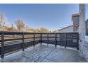 Small private patio with a modern black fence at 2571 W 69Th Pl, Denver, CO 80221