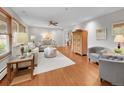Bright living room with hardwood floors, neutral decor, and ample seating at 6550 E 6Th Avenue Pkwy, Denver, CO 80220