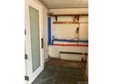 Unfinished basement with pipes and storage at 571 Geneva St, Aurora, CO 80010
