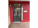 Front entrance with security door and mailbox at 571 Geneva St, Aurora, CO 80010