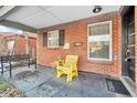 Cozy front porch with brick walls, space for seating, and a welcoming vibe at 2531 Niagara St, Denver, CO 80207