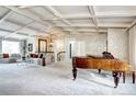 Inviting living room showcasing coffered ceilings, a grand piano, and stylish decor at 561 Saulsbury St, Lakewood, CO 80226
