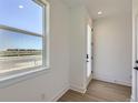 Bright foyer features hardwood floors and a large window with natural light at 20588 E 63Rd Ave, Aurora, CO 80019