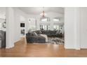Spacious living room with vaulted ceilings, large windows, and a comfortable sectional sofa at 1510 S De Gaulle Cir, Aurora, CO 80018