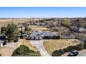 Wide aerial shot of a home with an attached three-car garage and large yard at 2208 Champlain Dr, Boulder, CO 80301